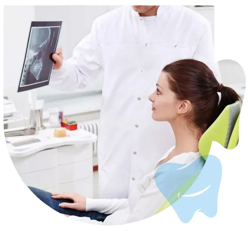 Dentist reviewing a dental X-ray with a patient at CitiDental of Woodhaven