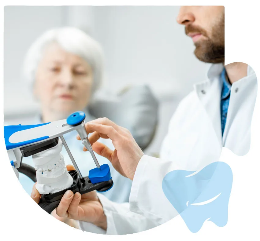 Dentist fitting a patient with dentures at CitiDental of Woodhaven